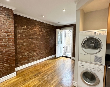 E 13th St. - Photo Thumbnail 1