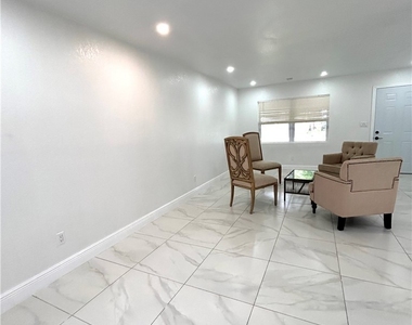 121 E 3rd Street - Photo Thumbnail 2