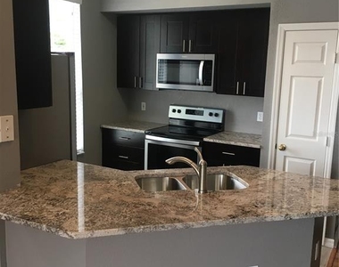 9744 Lake Chase Island Way - Photo Thumbnail 3