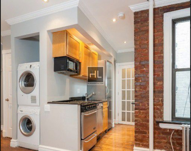 E 13th St. - Photo Thumbnail 2
