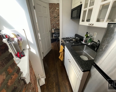 E 13th St. - Photo Thumbnail 2