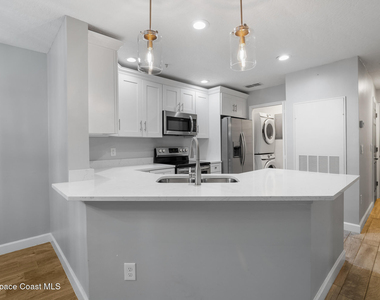 7667 N Wickham Road - Photo Thumbnail 1