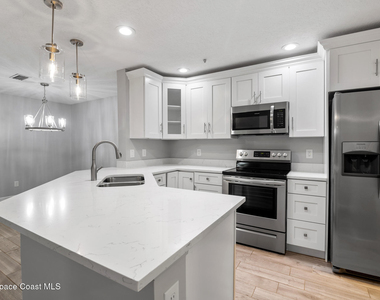 7667 N Wickham Road - Photo Thumbnail 3