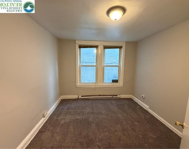 410 E 4th Street - Photo Thumbnail 5