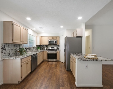 8910 Driftstone Drive - Photo Thumbnail 8