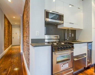 E 6th St. - Photo Thumbnail 1