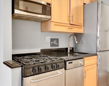 E 13th St. - Photo Thumbnail 3