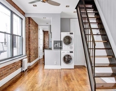 E 13th St. - Photo Thumbnail 4