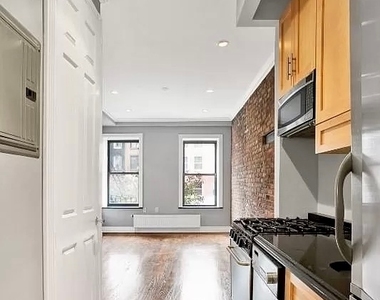 E 13th St. - Photo Thumbnail 2