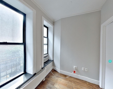 E 13th St. - Photo Thumbnail 7