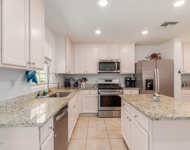 8216 W Albeniz Place - Photo Thumbnail 8