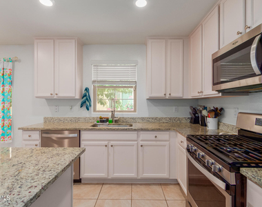 8216 W Albeniz Place - Photo Thumbnail 10