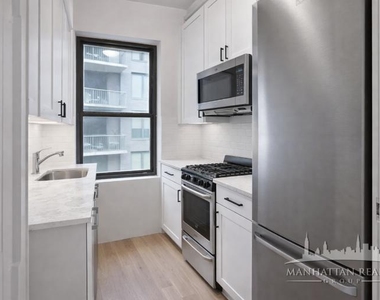E 56th St - Photo Thumbnail 2