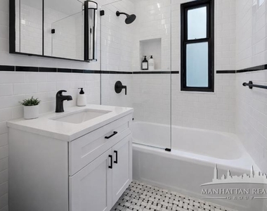 E 56th St - Photo Thumbnail 3