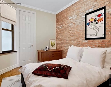 E 13th St. - Photo Thumbnail 3
