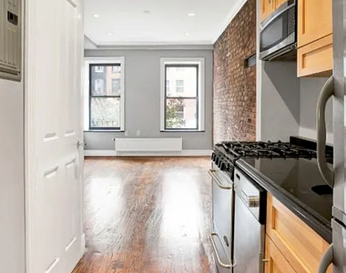 E 13th St. - Photo Thumbnail 2