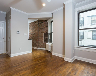 E 13th St. - Photo Thumbnail 2