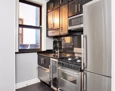 E 23rd St. - Photo Thumbnail 2