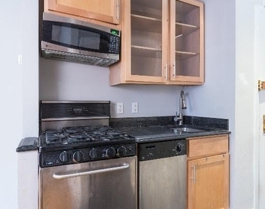 E 13th St. - Photo Thumbnail 4