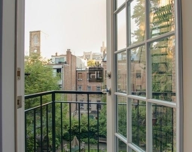 W 21st St. - Photo Thumbnail 2