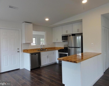 7029 Woodley Lane - Photo Thumbnail 3