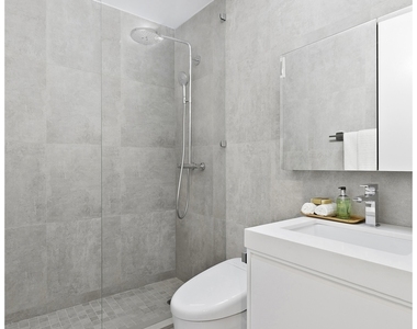 235 E 40th St - Photo Thumbnail 4