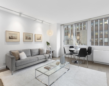 235 E 40th St - Photo Thumbnail 1