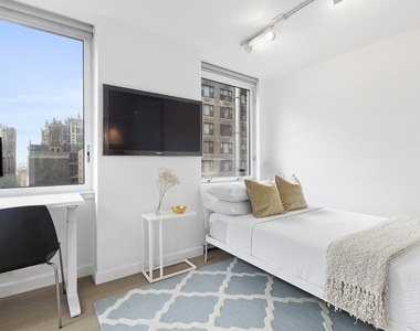 235 E 40th St - Photo Thumbnail 5