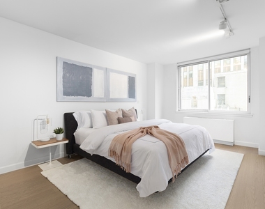 235 E 40th St - Photo Thumbnail 3