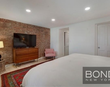233 E 18th Street - Photo Thumbnail 8