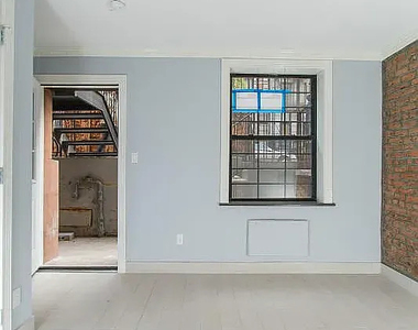 221 East 11th Street - Photo Thumbnail 1