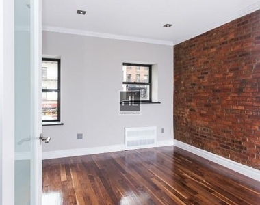 E 10th St. - Photo Thumbnail 2