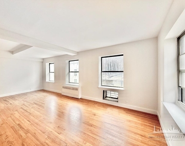 E 12th St - Photo Thumbnail 1