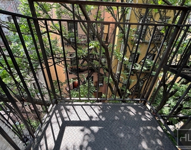 E 13th St. - Photo Thumbnail 4