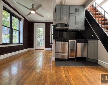 E 13th St. - Photo Thumbnail 3