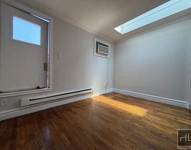 E 13th St. - Photo Thumbnail 9