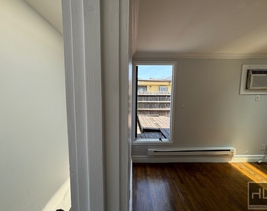 E 13th St. - Photo Thumbnail 12