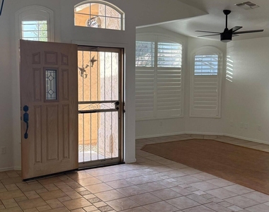 9621 W Potter Drive - Photo Thumbnail 3