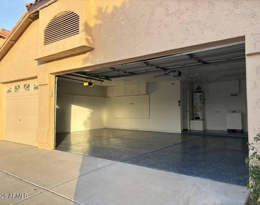 9621 W Potter Drive - Photo Thumbnail 1