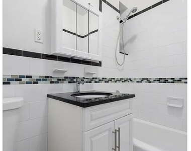 220 E 36th St - Photo Thumbnail 3