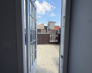 E 13th St. - Photo Thumbnail 3