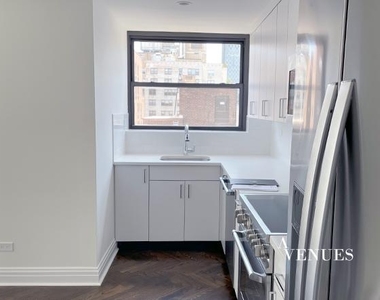 E 69th St, - Photo Thumbnail 5