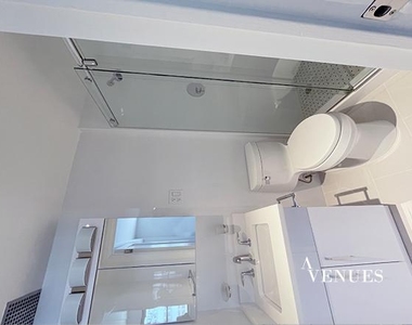 E 69th St, - Photo Thumbnail 13