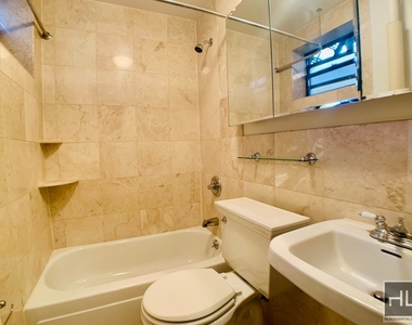 E 13th St. - Photo Thumbnail 4