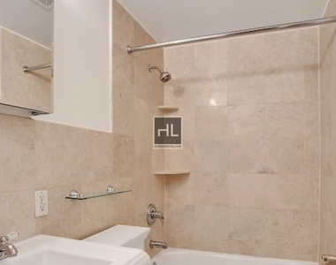 E 13th St. - Photo Thumbnail 4