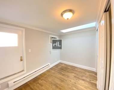 E 13th St. - Photo Thumbnail 2