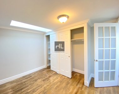 E 13th St. - Photo Thumbnail 3