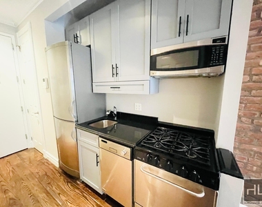 E 13th St. - Photo Thumbnail 3