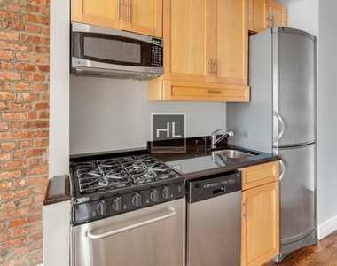 E 13th St. - Photo Thumbnail 1