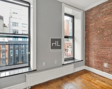 E 13th St. - Photo Thumbnail 2